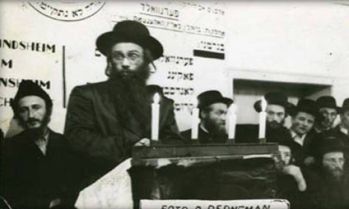 Rabbi Avraham David Horowitz Av Beit Din of Strasbourg in a conversation with Rabbi Yekutiel Yehuda Halberstam of Sanz-Kloiznburg in Peranwald at the She'erit HaPleita camp